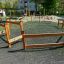 Trim trail wooden playground fitness course with various climbing and balancing elements.