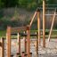 Trim trail wooden outdoor fitness and climbing equipment for playgrounds on sandy ground