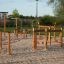 Trim trail wooden outdoor fitness and playground equipment on sand surface