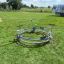 Bicycle merry-go-round on a grassy playground area.