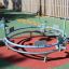 Bicycle merry-go-round in a playground under sunlight