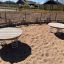 Two Wooden Balance Board platforms with springs in a playground.