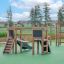Mini Play II playground equipment for children aged 3+ years on green safety surface outdoors