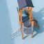 Pixie Modern Nature wooden playground tower with slide, climbing net, and tube bridge on safety surf