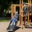 A child sliding down the slide of the Windsor Modern Nature castle.
