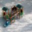 Forest Treehouse wooden playground with slide and climbing elements on sandy ground.