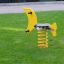 Yellow Seal Rocking spring rider on green grass.