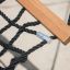 Triple Hammock (Metal) close-up showing sturdy black ropes and wooden support.