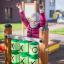 Child playing Tic Tac Toe on playground equipment.
