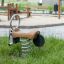 a robinia wood spring rocker on the playground