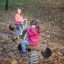 Girls playing on the robinia spring rocker