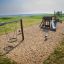 a robinia spring rider on the playground with wooden play equipment