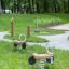 2 wooden spring riders installed on the grass
