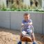 a boy rocking on the robinia spring rider