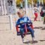 a girl swinging on the toddler seat swing