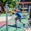 Children playing on Starfish steel structure playground equipment