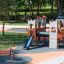 Spinner I playground roundabout with child playing on soft safety surface