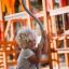 a child playing on the spinning roundabout