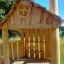 Tambora Eco wooden playhouse exterior with unique window and chimney design.