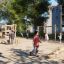 Children playing on Ural Eco playground equipment in a park.