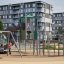 Alpha Centauri playground climbing frame with spiral slide and swing set in urban park