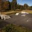 Outdoor Walk Box skate ramps and obstacles set in a park.