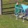 Sensory Box playground equipment with two children playing outdoors on grass.