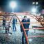 Cross Climber steel structure in a playground at night with children playing