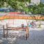 Steel playground structure with climbing elements.