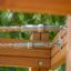 Close-up of Challenger Aztec wooden play structure with metal rope attachments