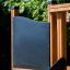 Outdoor play structure 'Little Jungle Nature' with wooden frame and black panel.