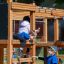 Children playing on Romping Center Nature playground.