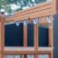 Playground equipment from the Romping Center Nature, featuring horizontal bars and climbing hooks.