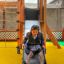 Child sliding down Gorilla Nature playground slide
