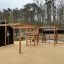 Motor Function Center Nature, wooden playhouse in a park.