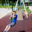 Child enjoying the Silver Cableway playground equipment.