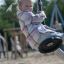 Child playing on Silver Cableway seat at playground