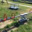 playground seesaw made of steel featuring red handles