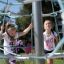 girls playing on the playground rope tower