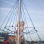 a girl climbing a rope tower on the playground