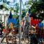 a girl climbing a rope pyramid playground outdoors