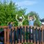 Children playing on the Square Play Nature playground bridge.