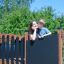 Mother and child on Square Play Nature structure in a park.