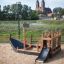 Small Ship Nature playground set with slide and climbing area.