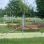Outdoor playground equipment for balance exercises in a park.