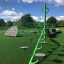 Green Balances playground equipment in a park.