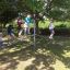 Children playing on the Balances outdoor playground equipment.