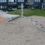 Playground equipment Balances consisting of a seesaw and balance steps in a sandy area.