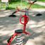 Red Bird swing rocking playground equipment in a park.