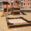 Sandbox Nature wooden playground set with slide and bridge in urban area.